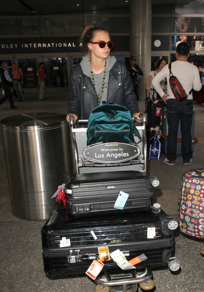 Cara Delevingne arrives in Los Angeles on the heels of reports she battled depression.  The English model was seen at LAX pushing her luggage cart to a waiting limo. Pictured: Cara Delevingne Ref: SPL1152202  141015   Picture by: Splash News Splash News and Pictures Los Angeles:	310-821-2666 New York:	212-619-2666 London:	870-934-2666 photodesk@splashnews.com 